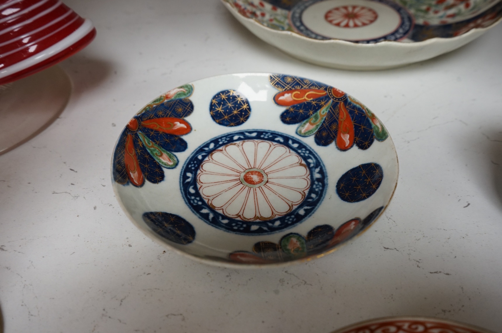 A Worcester Lord Henry Thynne type fluted tea bowl and saucer, c.1780, a group of Worcester Queen Charlotte pattern tea and coffee wares, c.1790-1810, two Worcester Kakiemon style dishes, largest 21cm in diameter